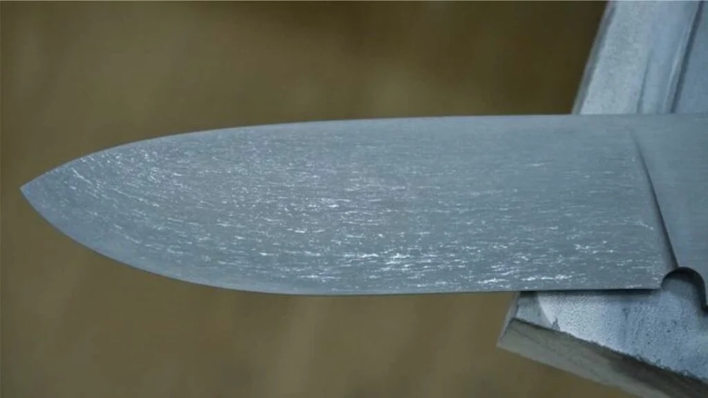 The carbide structure shown etched on a blade.